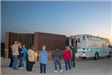 Group Standing by Ambulance